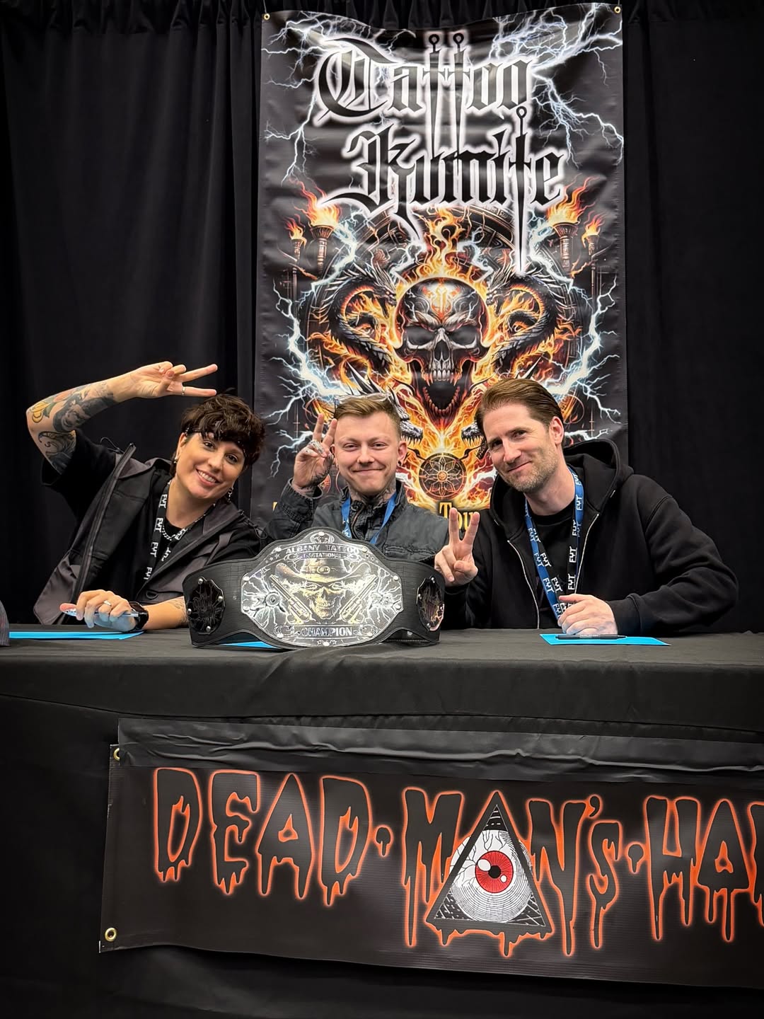 Judges panel with championship belt