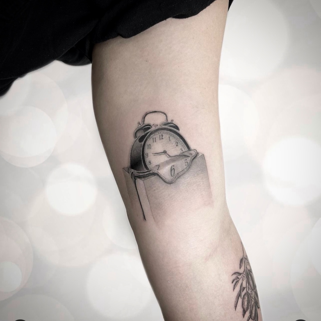 Microrealism Dali melting clock on book